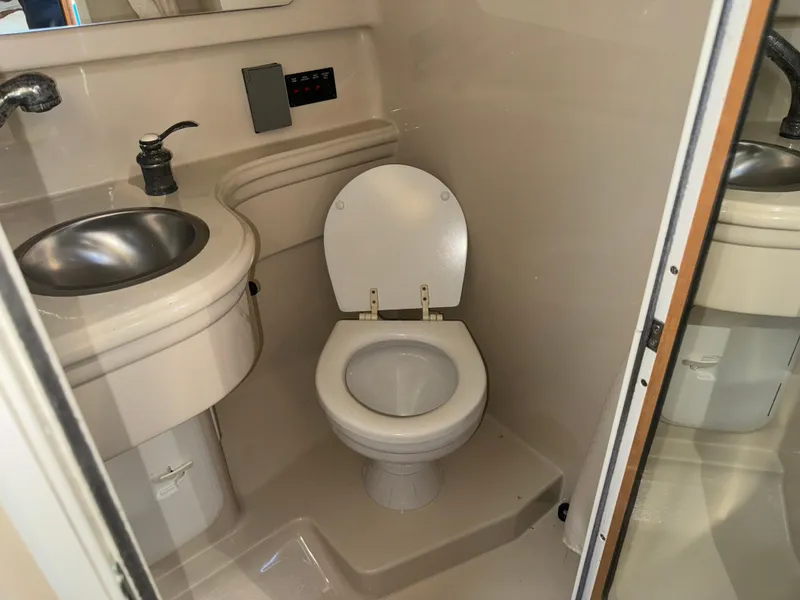 Slide: The Image of 2011 Glastron GS 289 boat bathroom with sink and toilet. - 50