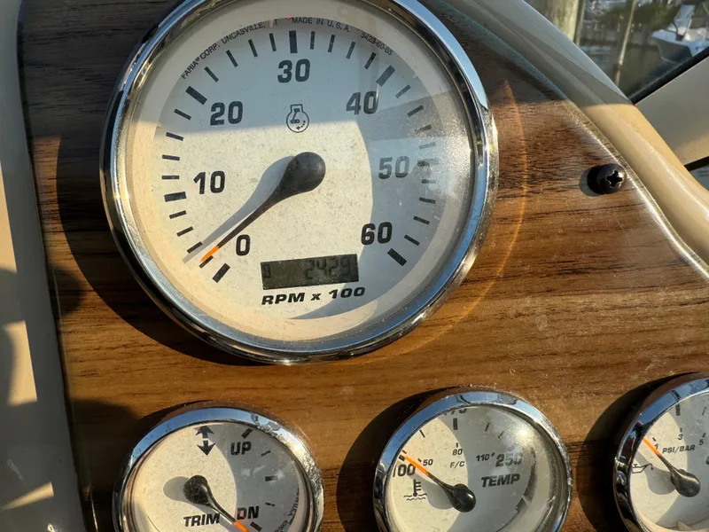 Slide: The Image of Dashboard of 2011 Glastron GS 289 boat showing RPM and gauges. - 33