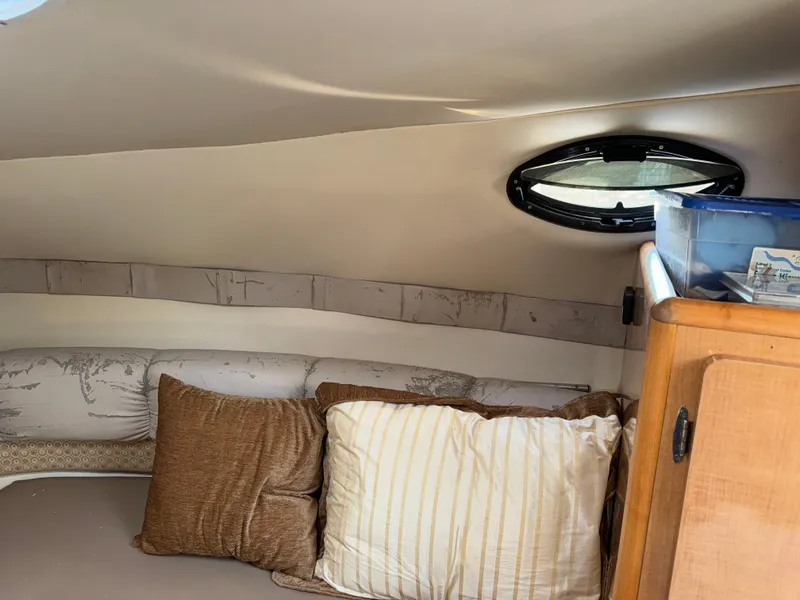 Slide: The Image of Interior cabin of 2011 Glastron GS 289 boat with cushions and storage. - 35
