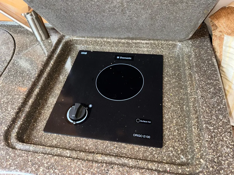 Slide: The Image of Built-in Dometic Origo E100 stove on 2011 Glastron GS 289 boat. - 39
