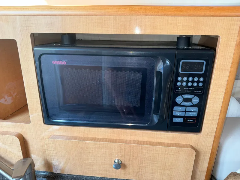 Slide: The Image of Microwave installed in 2011 Glastron GS 289 boat's wooden interior. - 40
