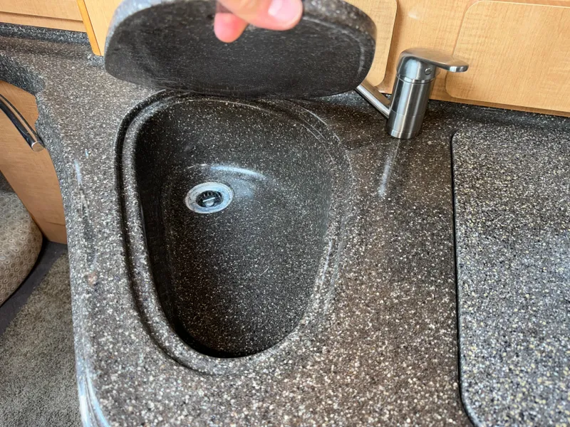 Slide: The Image of Granite sink and faucet in 2011 Glastron GS 289 boat kitchen area. - 42
