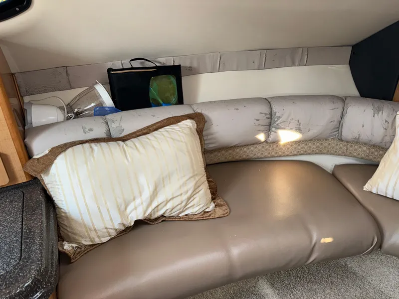Slide: The Image of Interior of 2011 Glastron GS 289 boat with cushioned seating and pillows. - 36