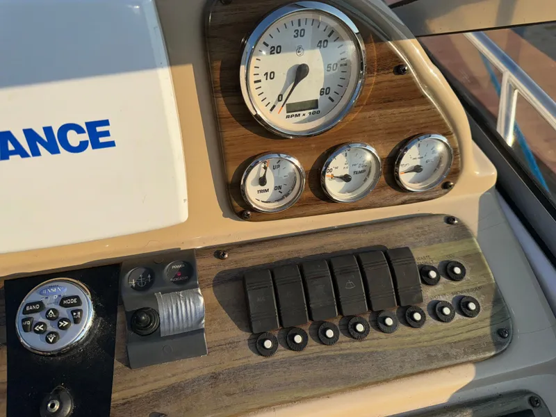 Slide: The Image of Dashboard of 2011 Glastron GS 289 boat with gauges and controls. - 30