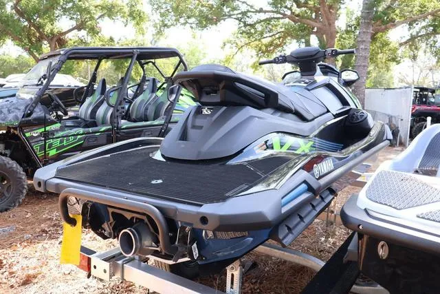 Slide: The Image of 2024 Yamaha Marine Waverunner VX Deluxe with audio, black, parked outdoors. - 4