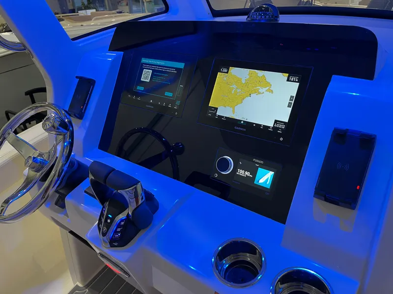 Slide: The Image of 2025 Scout 260 LXF boat dashboard with advanced navigation and control systems. - 10