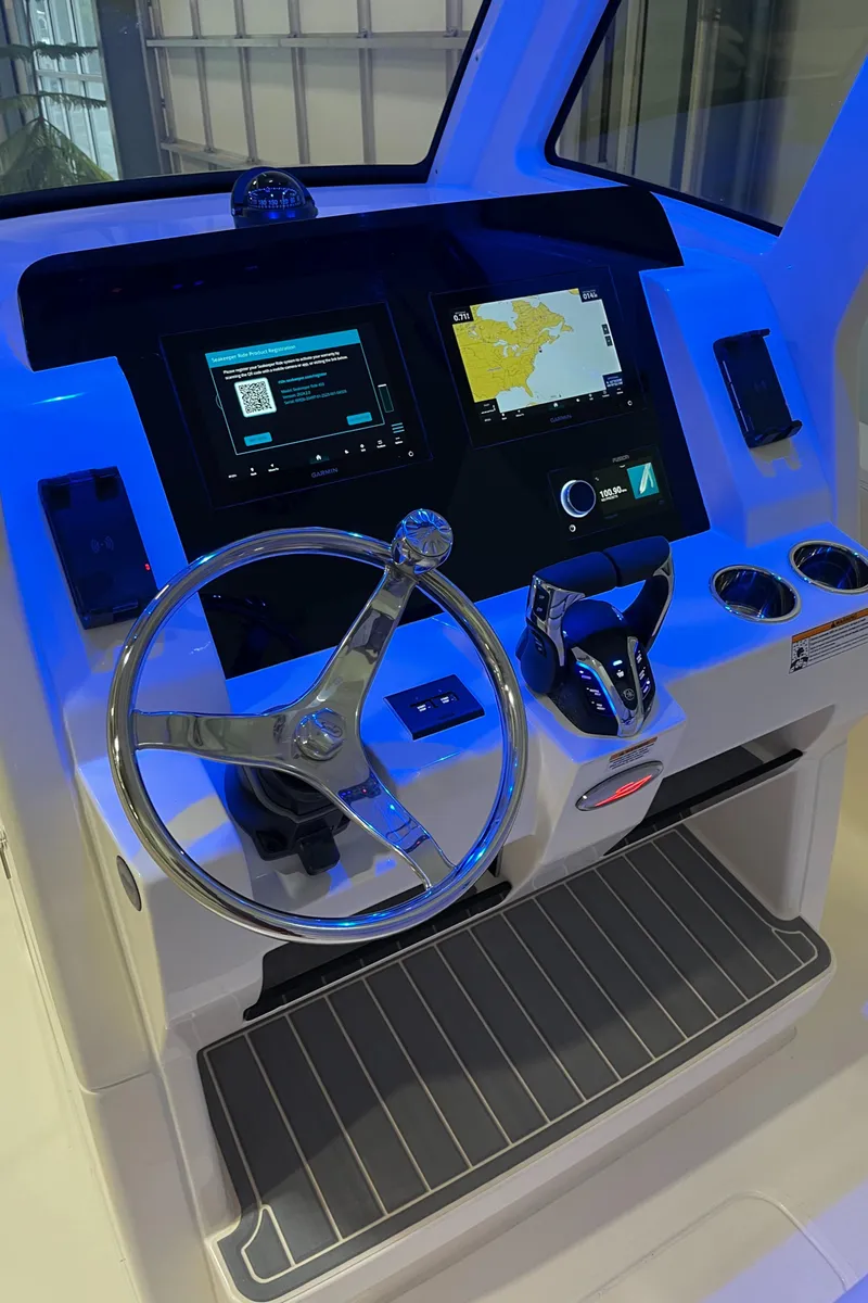 Slide: The Image of 2025 Scout 260 LXF boat dashboard with modern navigation and control systems. - 15