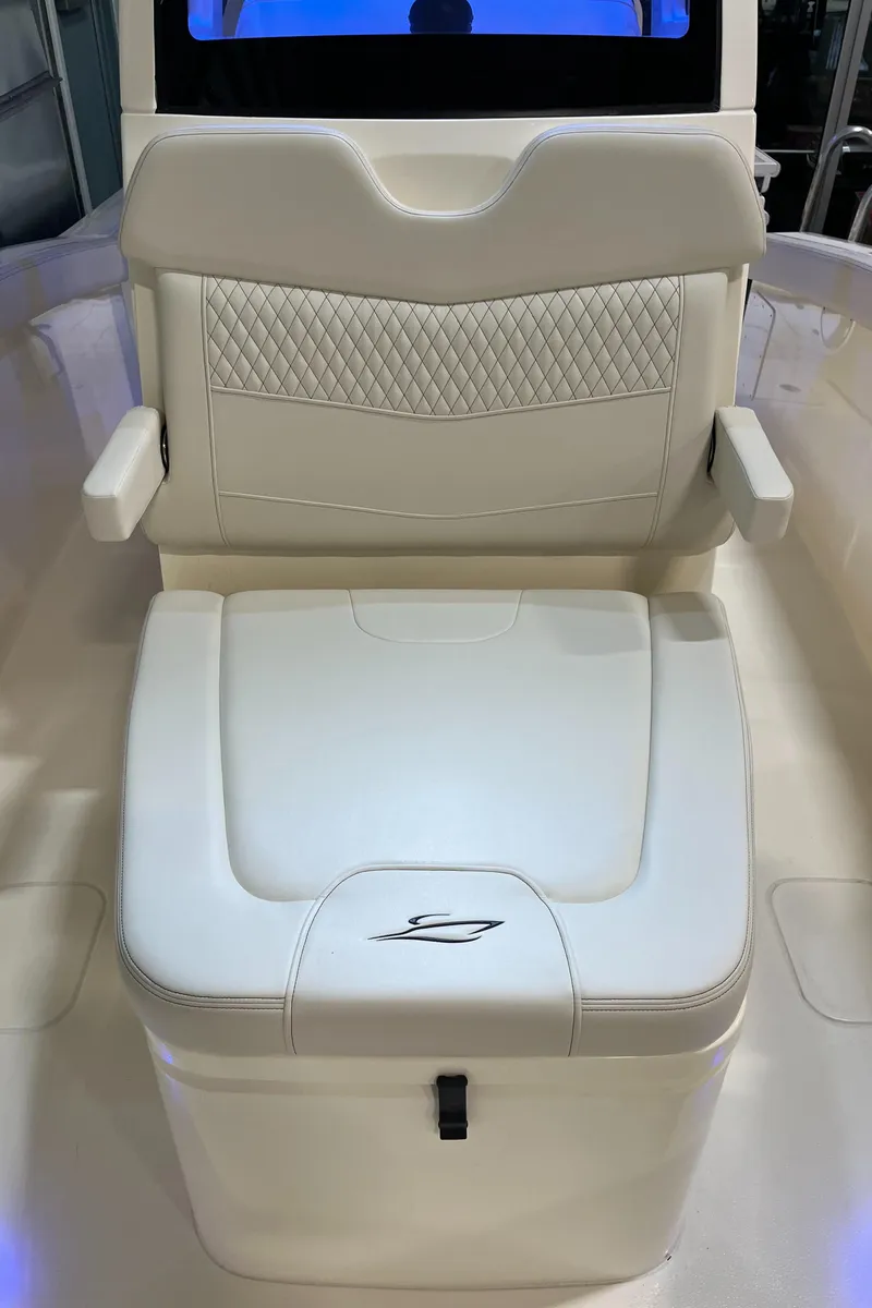 Slide: The Image of 2025 Scout 260 LXF boat seat with armrests and storage compartment. - 18