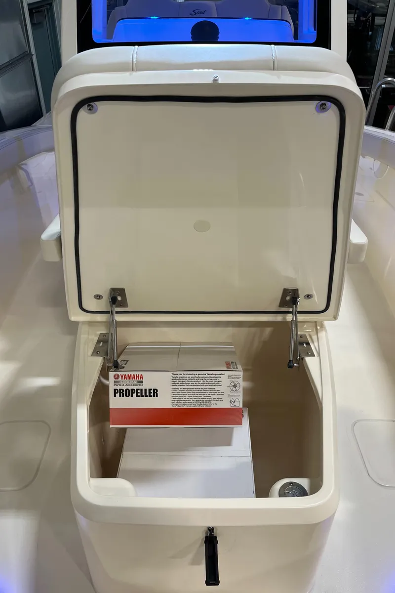 Slide: The Image of 2025 Scout 260 LXF storage compartment with Yamaha propeller box. - 19