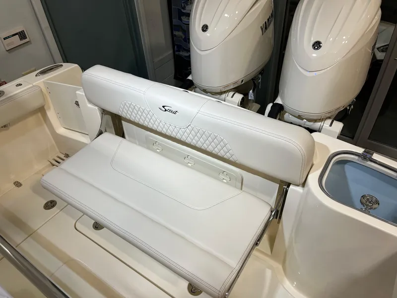 Slide: The Image of 2025 Scout 260 LXF boat with white leather seating and dual Yamaha engines. - 2