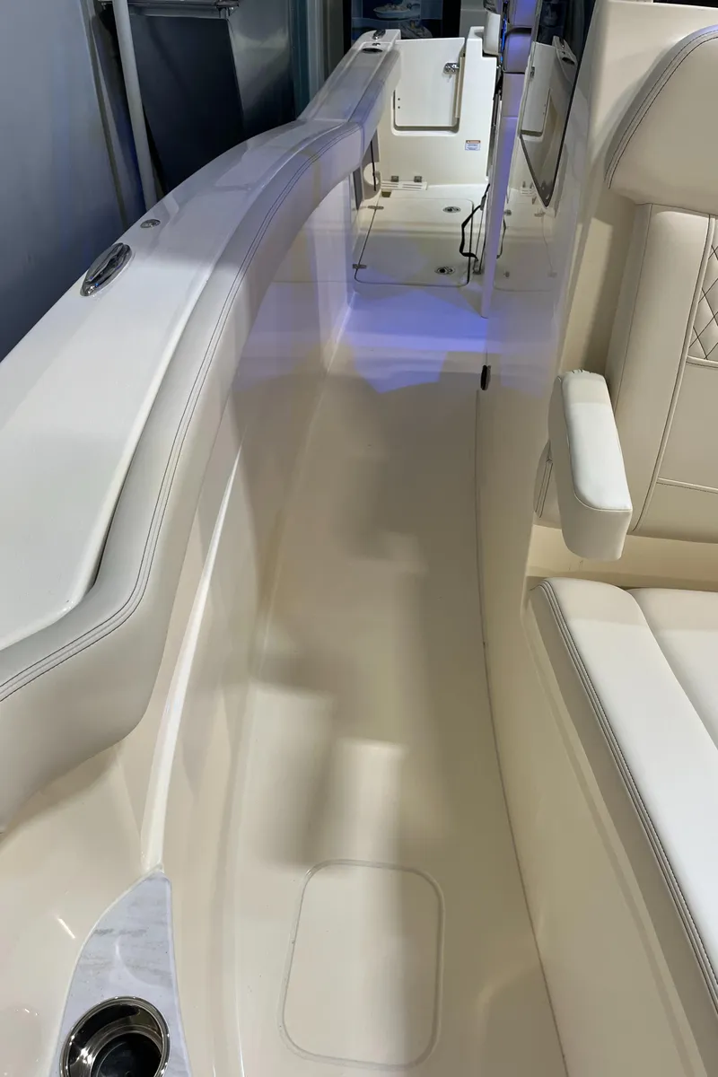 Slide: The Image of 2025 Scout 260 LXF boat interior with white seating and sleek design. - 20