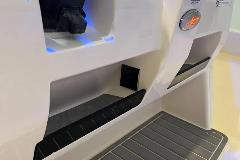Slide: The Image of 2025 Scout 260 LXF boat interior with illuminated compartments and sleek design. - 25