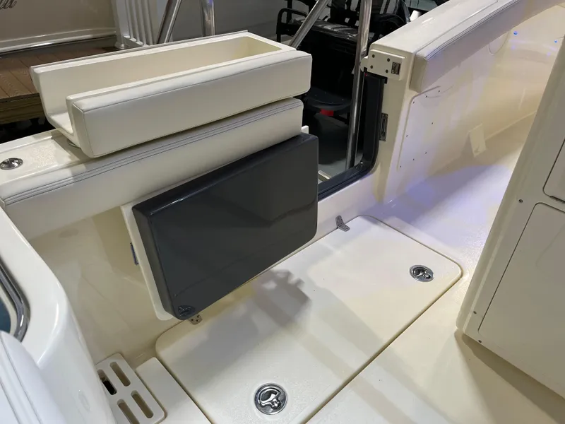 Slide: The Image of 2025 Scout 260 LXF boat interior with foldable seat and storage compartments. - 4