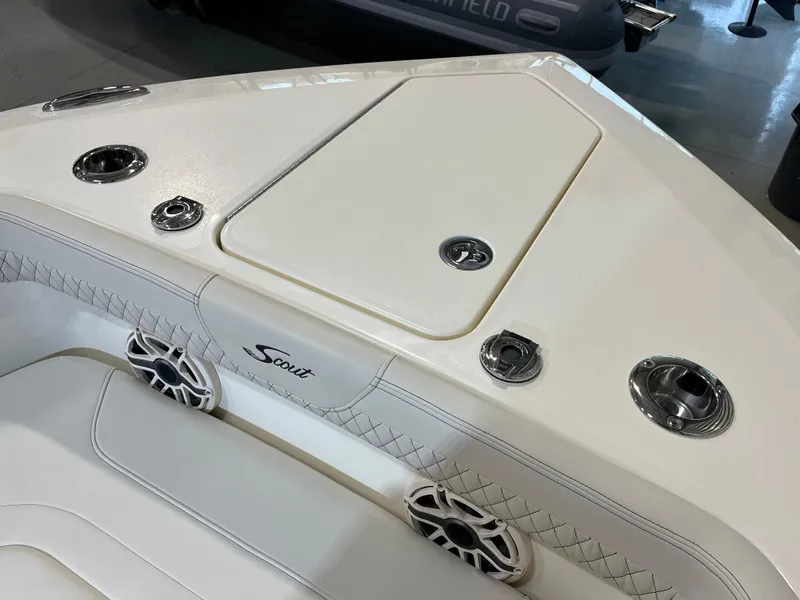 Slide: The Image of 2025 Scout 260 LXF boat interior with storage compartment and speakers. - 9