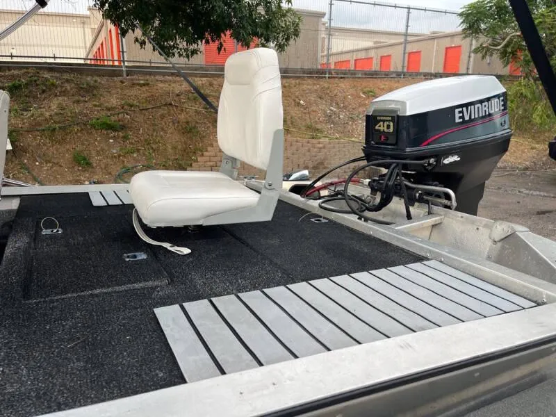 Slide: The Image of 1990 Bass Tracker Pro 17 boat with Evinrude 40 HP outboard motor. - 16