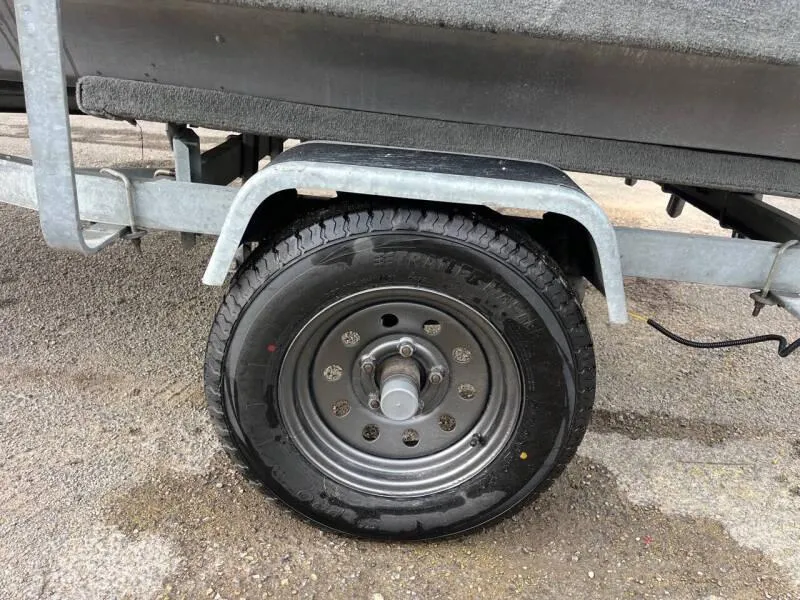 Slide: The Image of 1990 Bass Tracker Pro 17 boat trailer wheel and tire. - 21