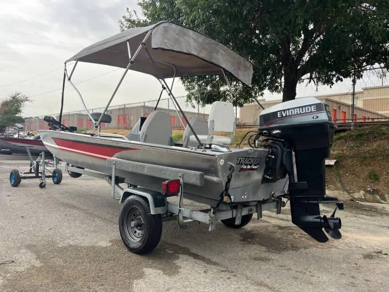 Slide: The Image of 1990 Bass Tracker Pro 17 boat with Evinrude motor on trailer. - 4