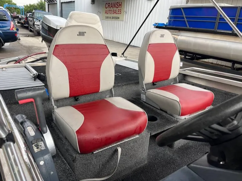 Slide: The Image of 1990 Bass Tracker Pro 17 boat with red and white seats at Cransh Auto Sales. - 8