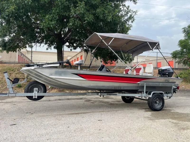 Slide: The Image of 1990 Bass Tracker Pro 17 fishing boat on trailer with canopy. - 9