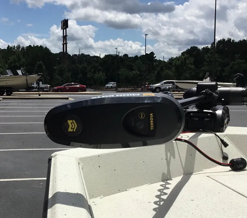 Slide: The Image of 2024 Ranger RB210 boat with Minn Kota Terrova trolling motor in parking lot. - 4