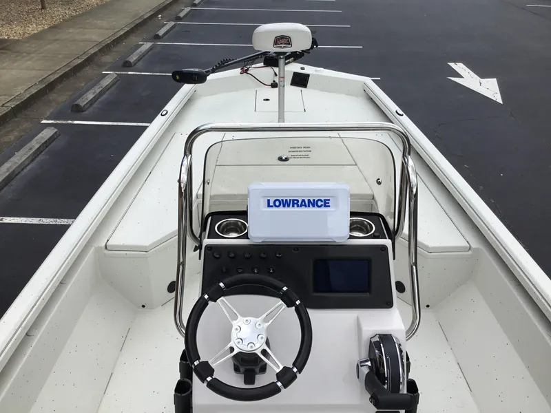 Slide: The Image of 2024 Ranger RB210 boat dashboard with Lowrance navigation system and steering wheel. - 5