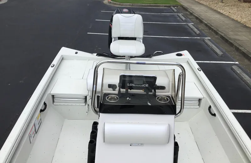 Slide: The Image of 2024 Ranger RB210 boat interior with console and seating. - 6