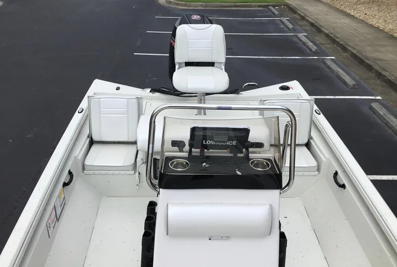 Slide: The Image of 2024 Ranger RB210 boat interior with white seating and Lowrance electronics. - 7