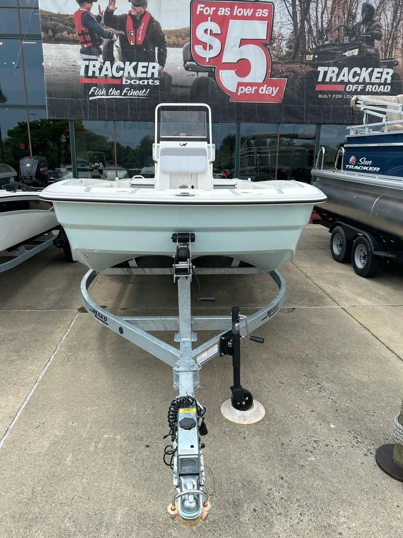 Slide: The Image of 2024 Mako Pro Skiff 19 CC boat on trailer at dealership. - 2