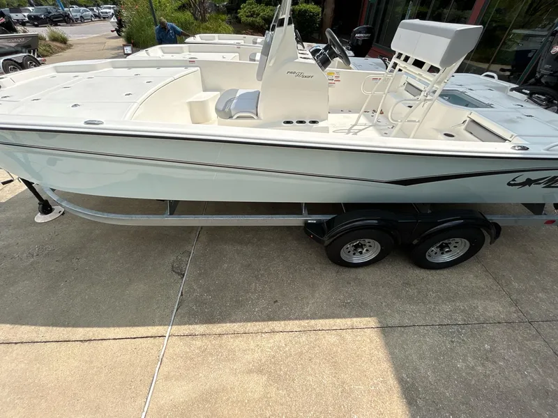 Slide: The Image of 2024 Mako Pro Skiff 19 CC boat on trailer, side view. - 5