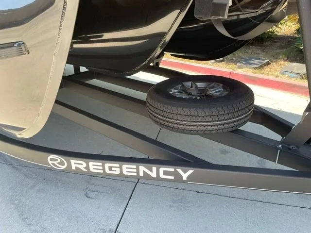 Slide: The Image of Alt text: 2024 Regency 230 DL3 boat trailer with spare tire. - 10