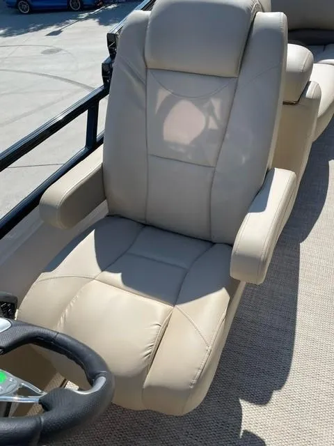 Slide: The Image of 2024 Regency 230 DL3 boat captain's chair with beige upholstery. - 13