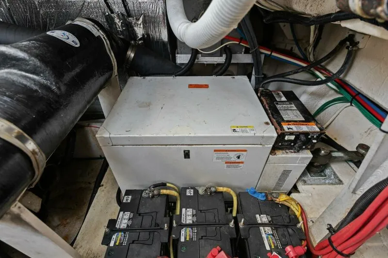 Slide: The Image of Engine compartment of a 2002 Cruisers Yachts 3672 Express with batteries and electrical components. - 43