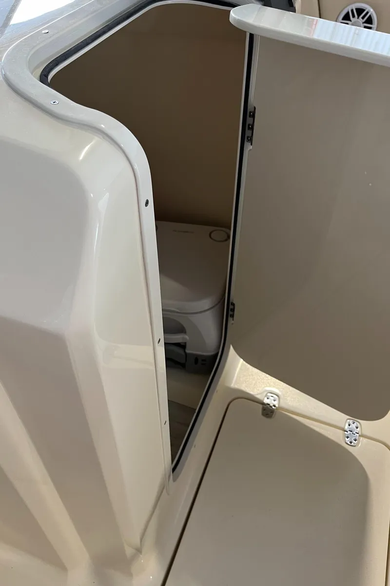 Slide: The Image of 2024 Scout 215 Dorado boat interior storage compartment. - 13