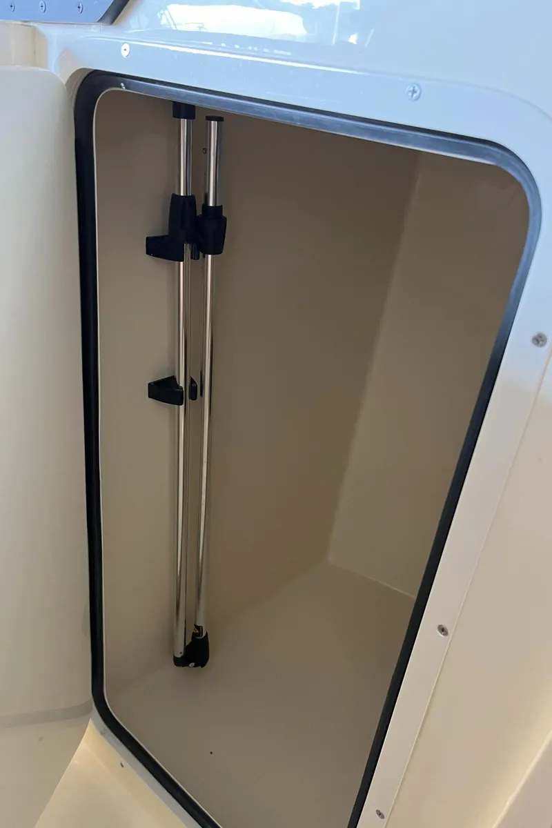 Slide: The Image of Storage compartment of 2024 Scout 215 Dorado boat. - 14