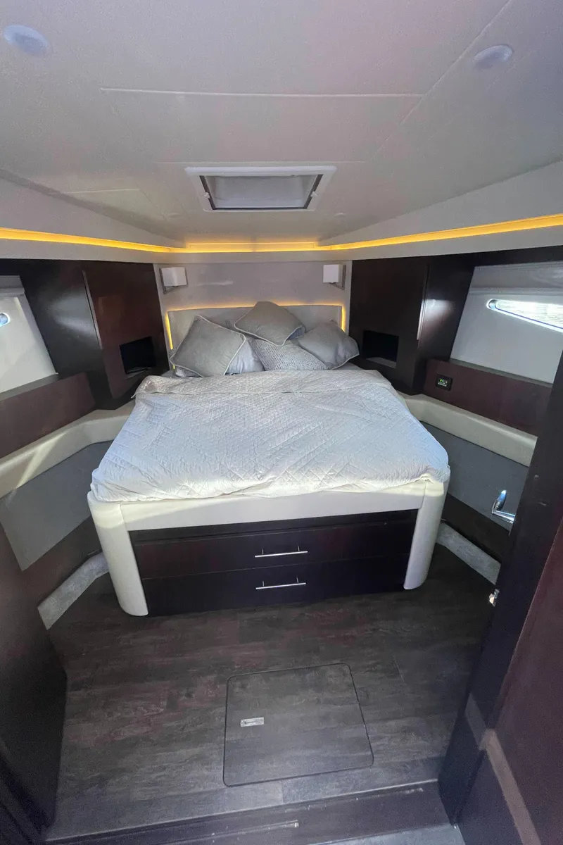 Slide: The Image of Luxurious bedroom interior of a 2019 Regal 42 Grande Coupe yacht. - 19