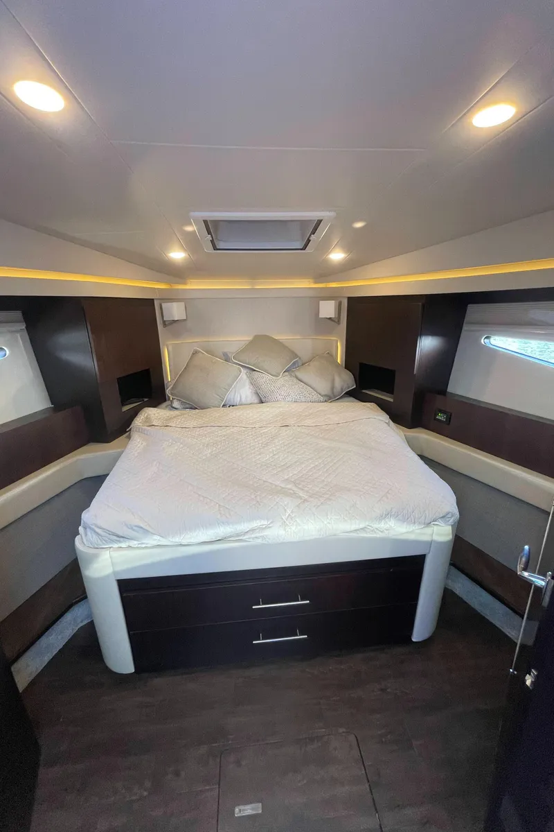 Slide: The Image of Luxurious bedroom in 2019 Regal 42 Grande Coupe yacht with modern lighting. - 22