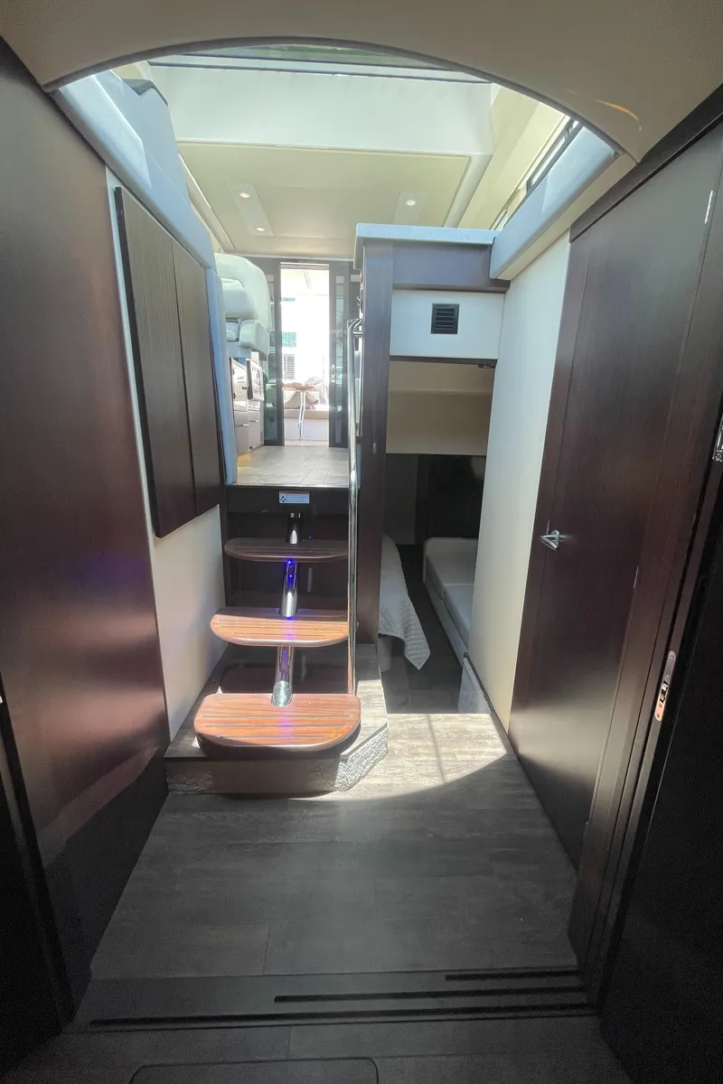 Slide: The Image of Interior of 2019 Regal 42 Grande Coupe yacht with modern design and wooden steps. - 27