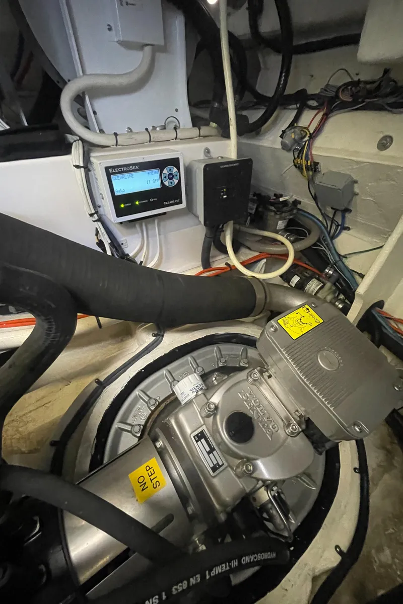 Slide: The Image of Engine room of a 2019 Regal 42 Grande Coupe yacht with mechanical components. - 28