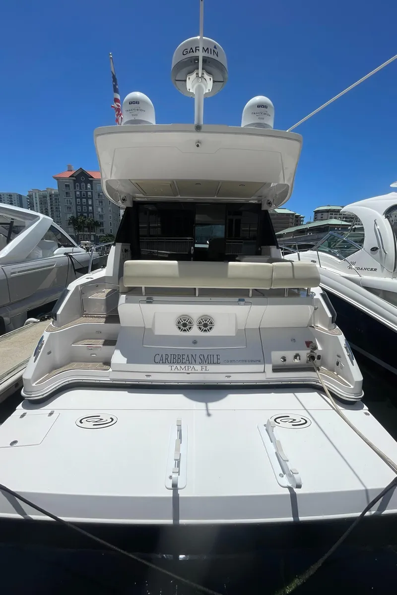 Slide: The Image of 2019 Regal 42 Grande Coupe yacht docked, rear view. - 31
