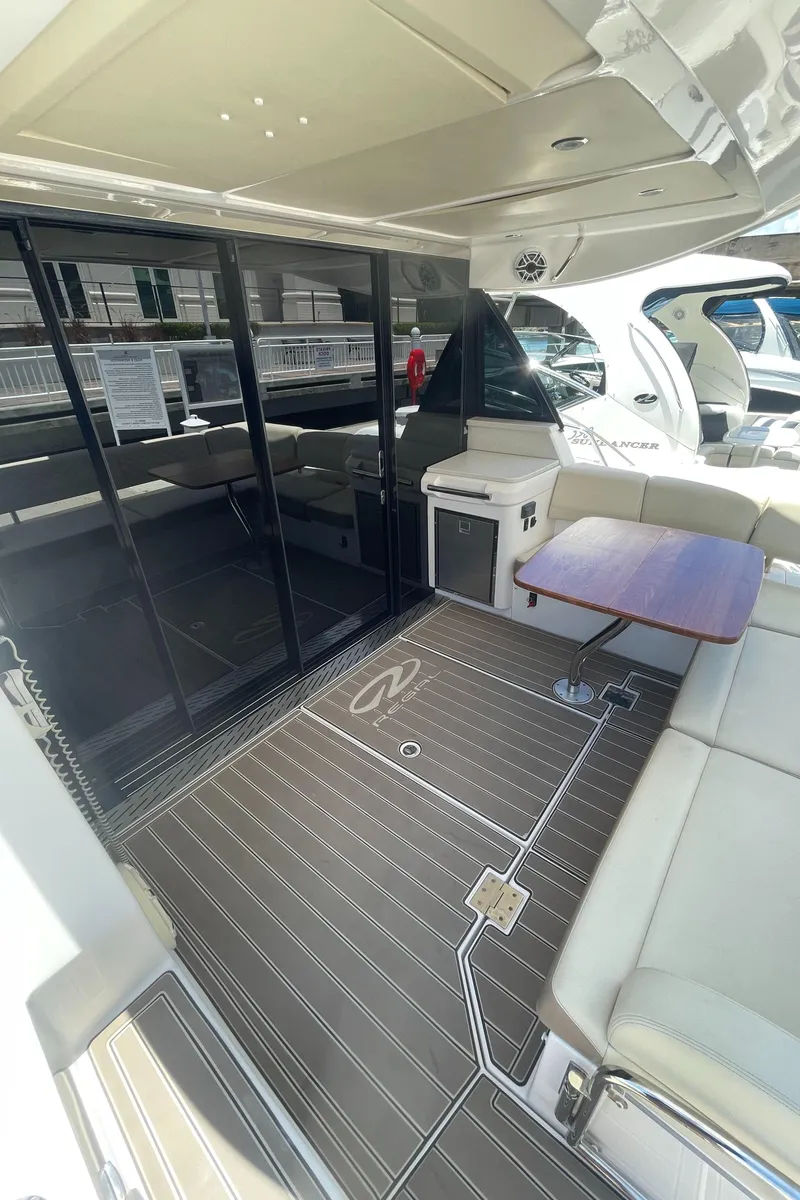 Slide: The Image of 2019 Regal 42 Grande Coupe yacht with spacious deck and seating area. - 4