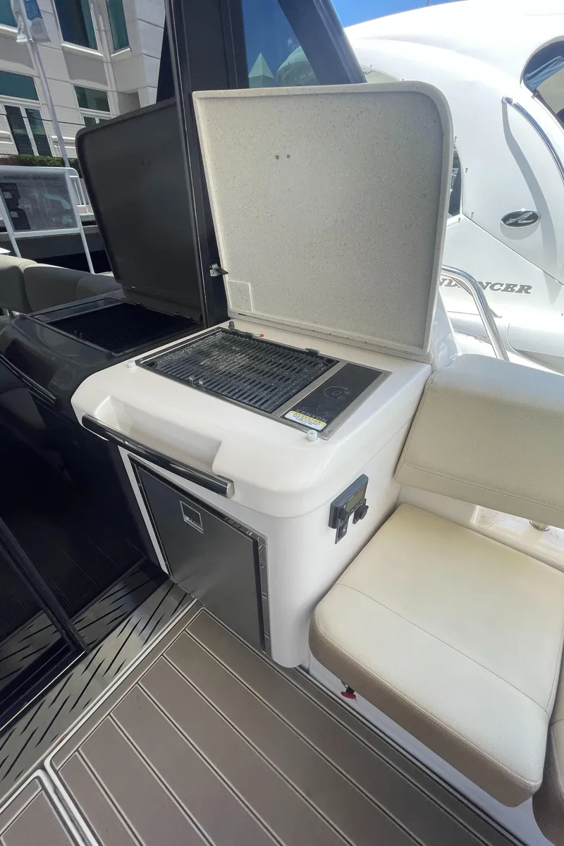 Slide: The Image of Outdoor grill and seating area on a 2019 Regal 42 Grande Coupe yacht. - 5