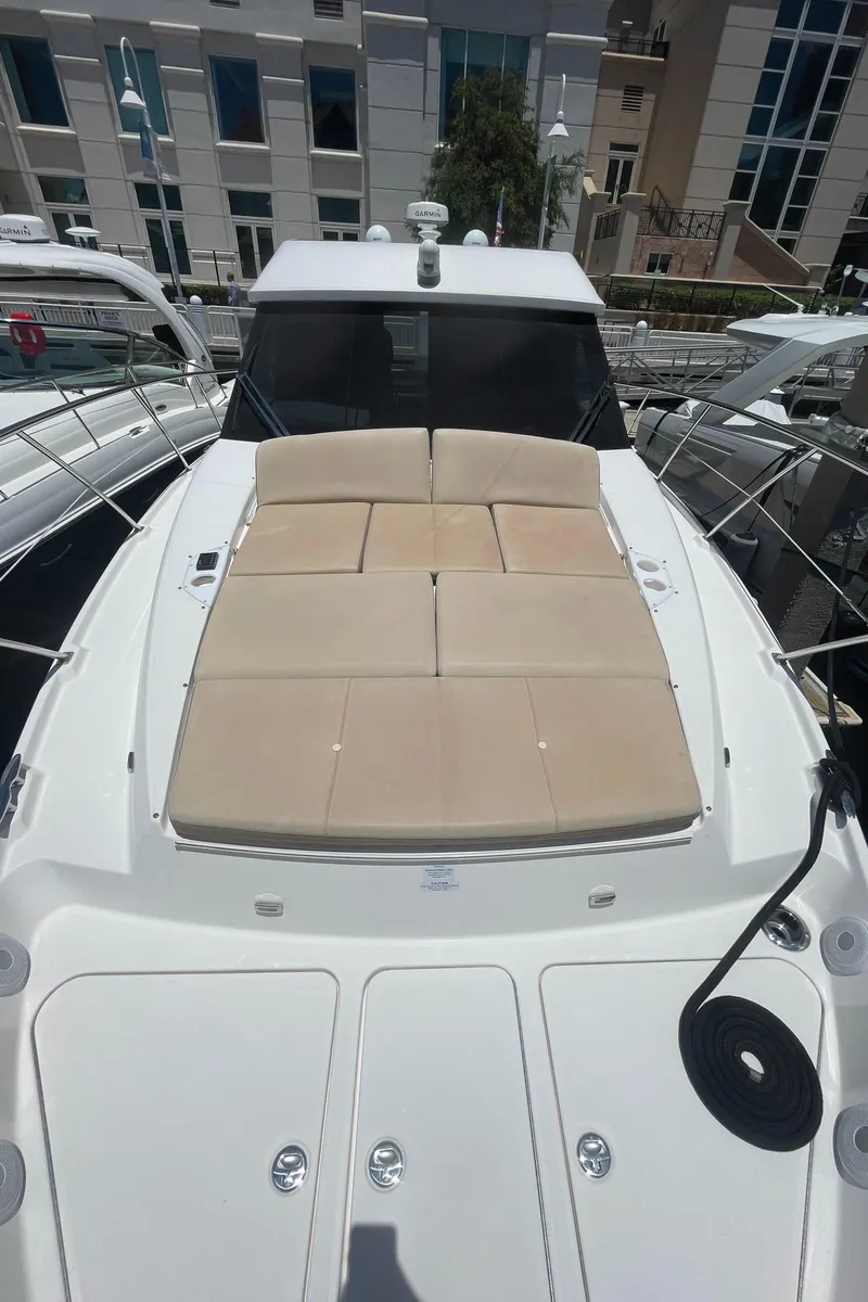 Slide: The Image of 2019 Regal 42 Grande Coupe yacht with spacious sunbathing deck. - 9