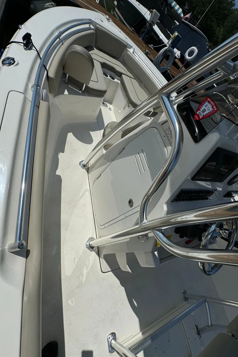 Slide: The Image of 2023 Key West 239 FS boat interior with seating and console. - 12