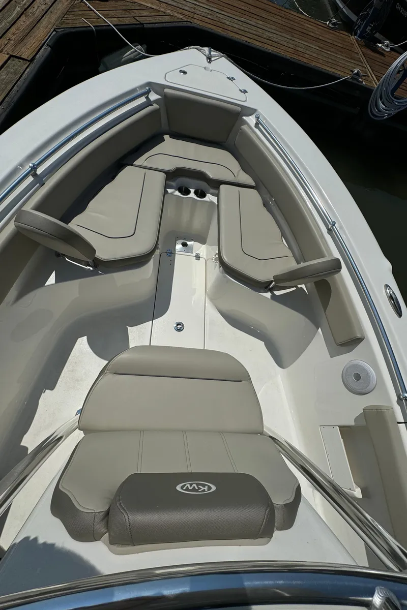 Slide: The Image of 2023 Key West 239 FS boat interior with cushioned seating. - 13