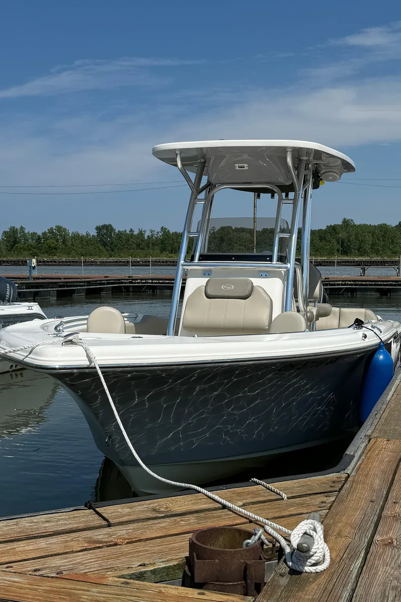 Slide: The Image of 2023 Key West 239 FS boat docked at a marina. - 17