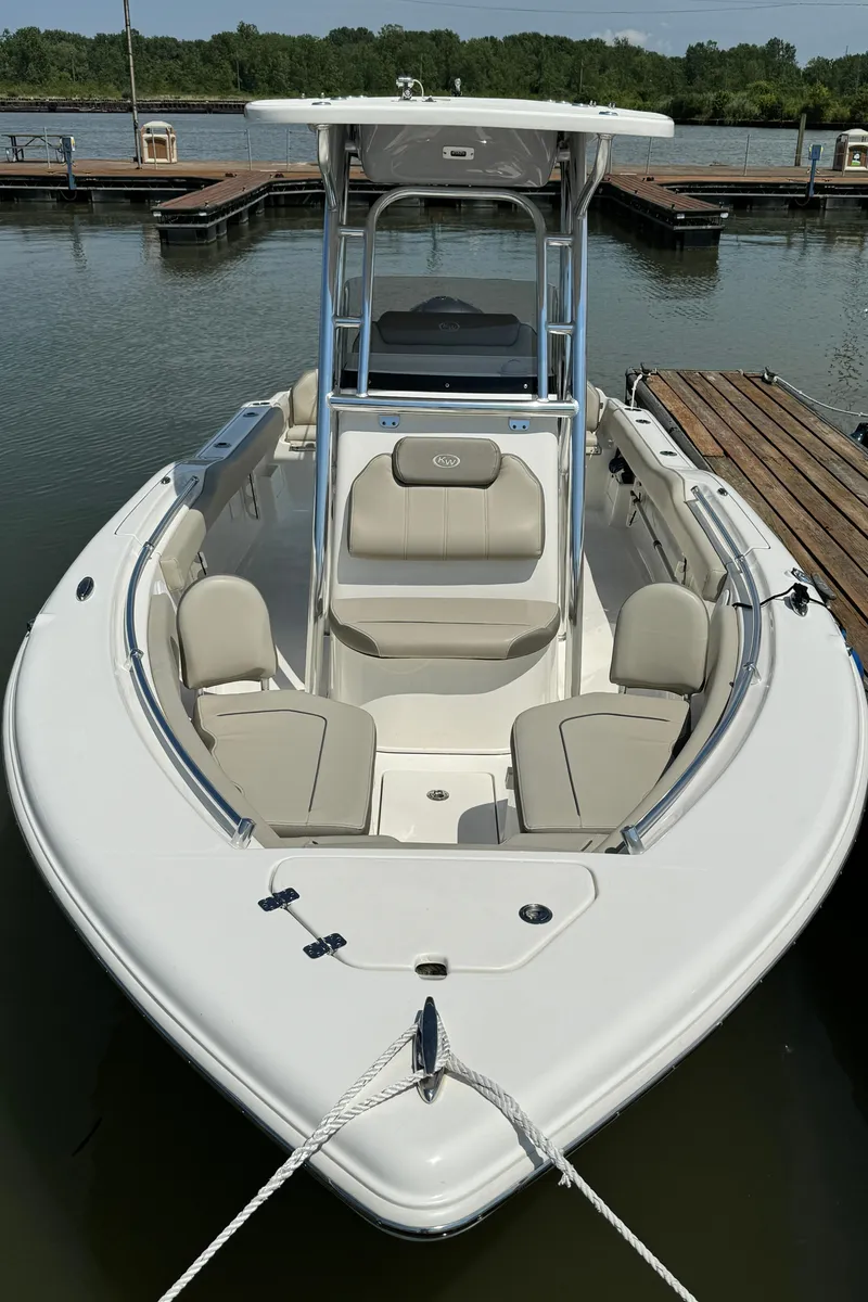 Slide: The Image of 2023 Key West 239 FS boat docked at a marina. - 2