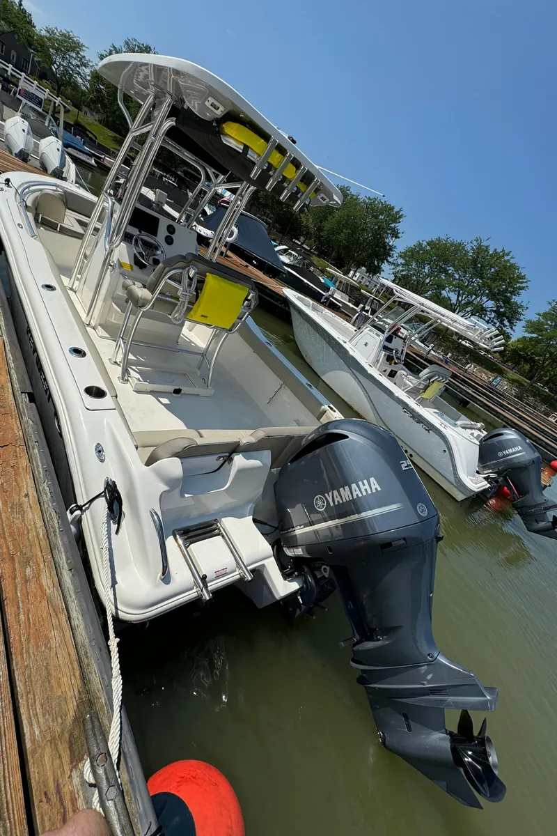Slide: The Image of 2023 Key West 239 FS boat docked with Yamaha outboard motor. - 3