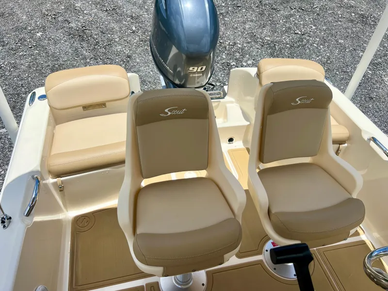 Slide: The Image of 2019 Scout Sportfish 175 boat interior with beige seats and 90 HP engine. - 11