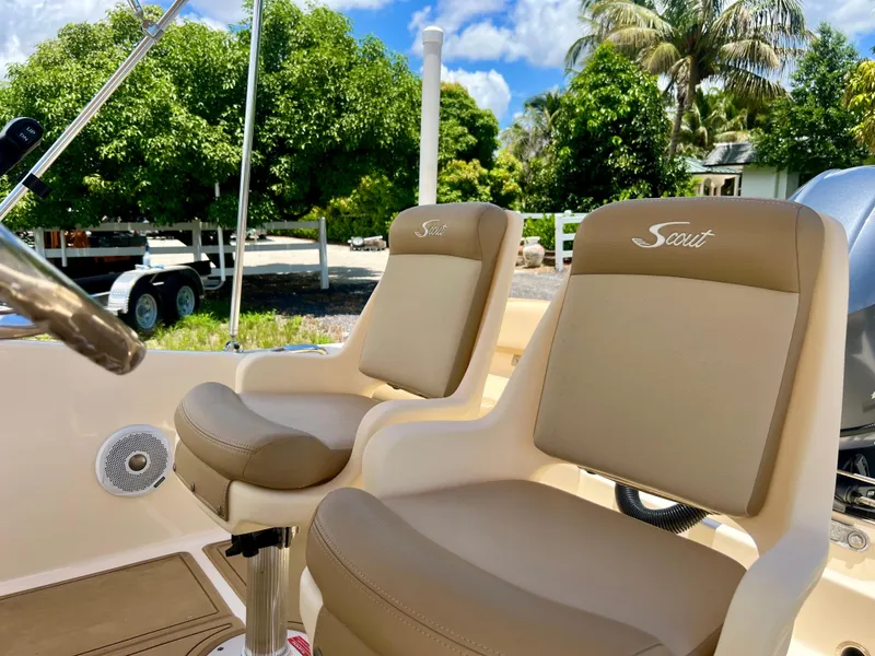 Slide: The Image of 2019 Scout Sportfish 175 boat seats with beige upholstery. - 12