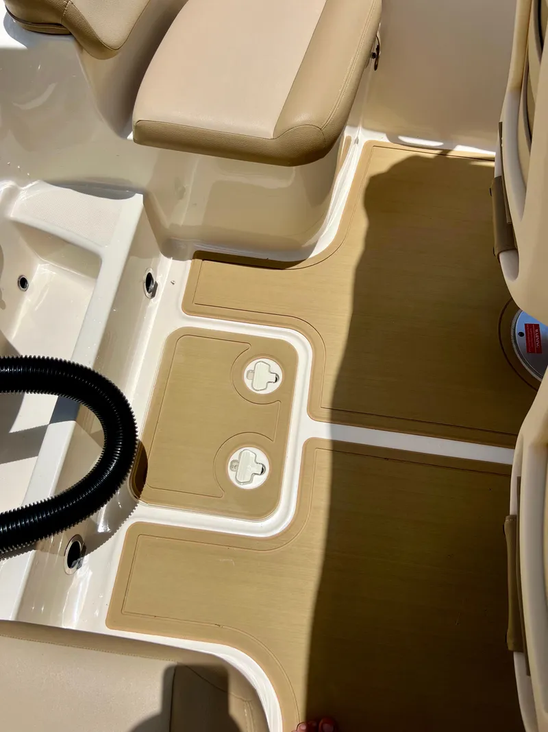 Slide: The Image of 2019 Scout Sportfish 175 boat interior with beige seating and deck. - 16